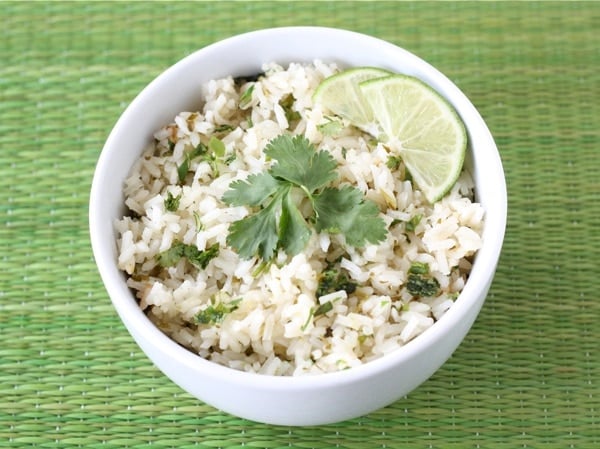 cilantro-lime-rice-2 cilantro lime rice with lime and parsley on top