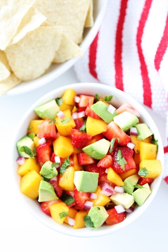 Strawberry Mango Salsa Recipe on twopeasandtheirpod.com Love this simple and fresh salsa! Mango Salsa Recipe with strawberries, avocado, red onion and cilantro