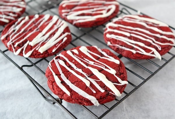 Red Velvet Cheesecake Cookies-these easy cake mix cookies are a holiday favorite! #cookies #cheesecake #redvelvet red velvet cheesecake cookies on cooling rack