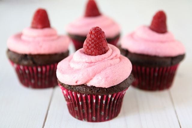Dark Chocolate Cupcakes with Raspberry Buttercream Frosting from Two Peas and Their Pod (www.twopeasandtheirpod.com) #recipe #cupcakes