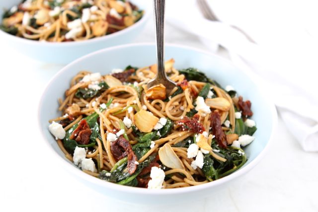 Spaghetti with Sun Dried Tomatoes, Spinach, Toasted Garlic & Feta from www.twopeasandtheirpod.com #recipe #vegetarian