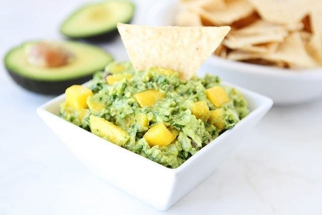 Mango Guacamole on twopeasandtheirpod.com Only takes a few minutes to make and is SO good! Mango Guacamole
