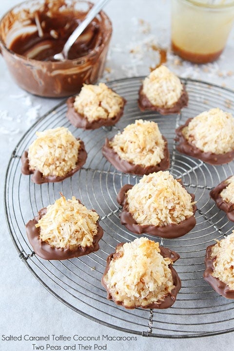 Salted Caramel Toffee Coconut Macaroons on twopeasandtheirpod.com They are dipped in chocolate too! The best coconut macaroons you will ever eat! Salted Caramel Toffee Coconut Macaroons on twopeasandtheirpod.com They are dipped in chocolate too! The best coconut macaroons you will ever eat!