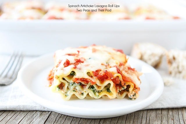 Spinach Artichoke Lasagna Roll Ups on twopeasandtheirpod.com Our family loves this easy recipe! Spinach Artichoke Lasagna Roll Ups on plate