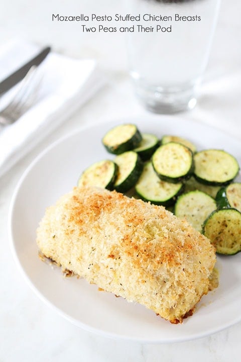 Mozzarella Pesto Stuffed Chicken Breasts Recipe on twopeasandtheirpod.com Love this easy baked chicken recipe! Mozzarella Pesto Stuffed Chicken Breasts Recipe served with zucchini