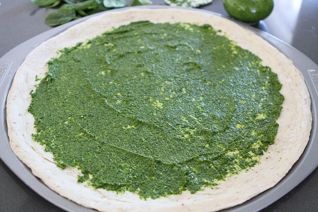 Spinach Artichoke Pesto Pizza Recipe on twopeasandtheirpod.com Spinach Artichoke Pesto Pizza Recipe on twopeasandtheirpod.com