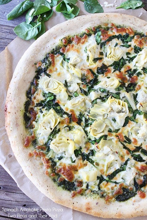 Spinach Artichoke Pesto Pizza Recipe on twopeasandtheirpod.com Spinach Artichoke Pesto Pizza Recipe on twopeasandtheirpod.com I bet you can't eat just one slice!