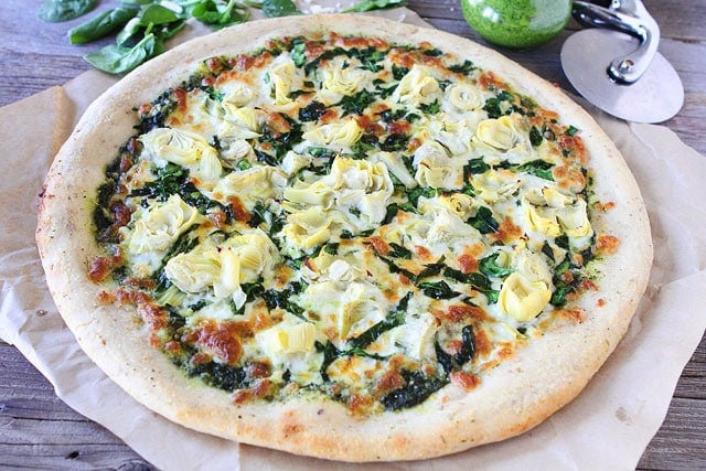 Spinach Artichoke Pesto Pizza on twopeasandtheirpod.com Spinach Artichoke Pesto Pizza Recipe on twopeasandtheirpod.com A fresh and simple pizza!