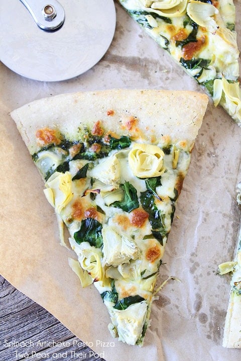 Spinach Artichoke Pesto Pizza Recipe on twopeasandtheirpod.com Spinach Artichoke Pesto Pizza Recipe on twopeasandtheirpod.com This vegetarian pizza is always a crowd pleaser!