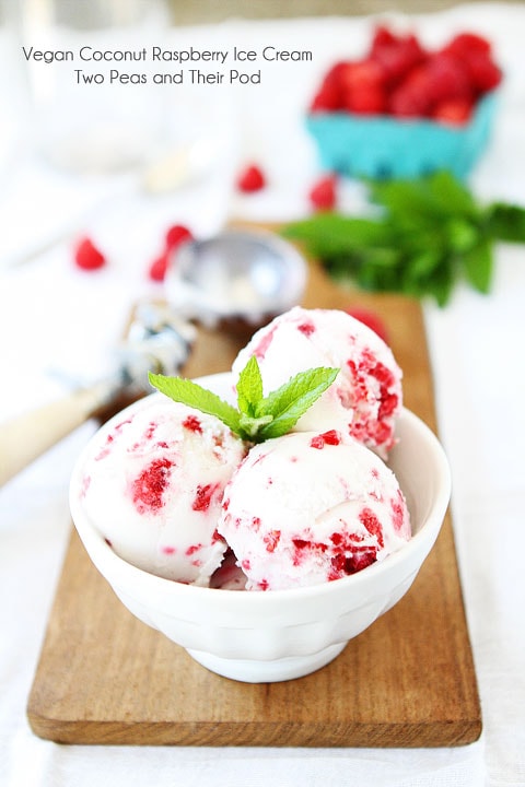 Vegan Coconut Raspberry Ice Cream Recipe on twopeasandtheirpod.com Only 4 ingredients needed to make this dreamy ice cream! vegan ice cream with raspberries and mint.