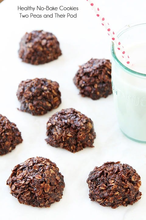 Healthy No-Bake Cookie Recipe on twopeasandtheirpod.com Gluten free no bake cookies set out to cool with glass of milk