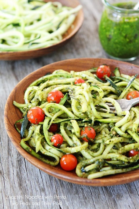 Easy Zucchini Noodles with Pesto on twopeasandtheirpod.com Zucchini Pasta tossed with Pesto in wood serving bowl