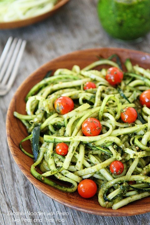 Zucchini Noodles with Pesto Recipe on twopeasandtheirpod.com Zucchini Pasta with pesto and tomatoes