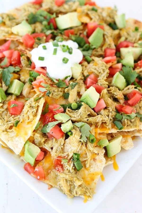 Chicken Chile Verde Nachos Recipe on twopeasandtheirpod.com Perfect for game day! Chicken Chile Verde Nachos Recipe on twopeasandtheirpod.com Perfect for game day!