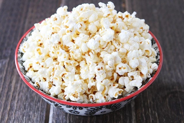 Easy Kettle Corn Recipe on twopeasandtheirpod.com #recipe Big bowl of kettle corn made at home