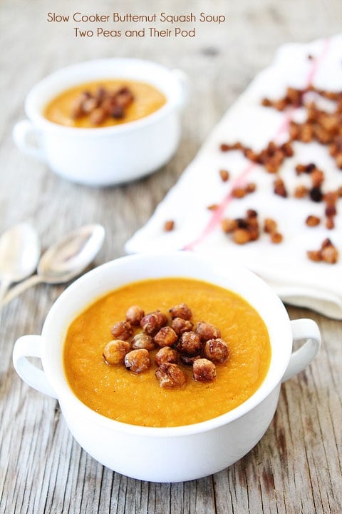 Slow Cooker Butternut Squash Soup with Maple Roasted Chickpeas Recipe on twopeasandtheirpod.com Love this easy and healthy soup recipe! crockpot butternut squash soup in bowl with roasted chickpeas.