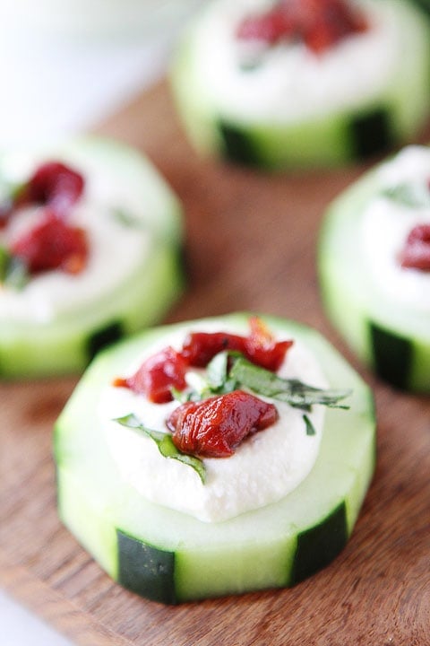 Cucumber Canapés with Whipped Feta, Sun-Dried Tomatoes and Basil on twopeasandtheirpod.com A simple holiday appetizer! Cucumber Canapés with Whipped Feta, Sun-Dried Tomatoes and Basil on twopeasandtheirpod.com A simple holiday appetizer!