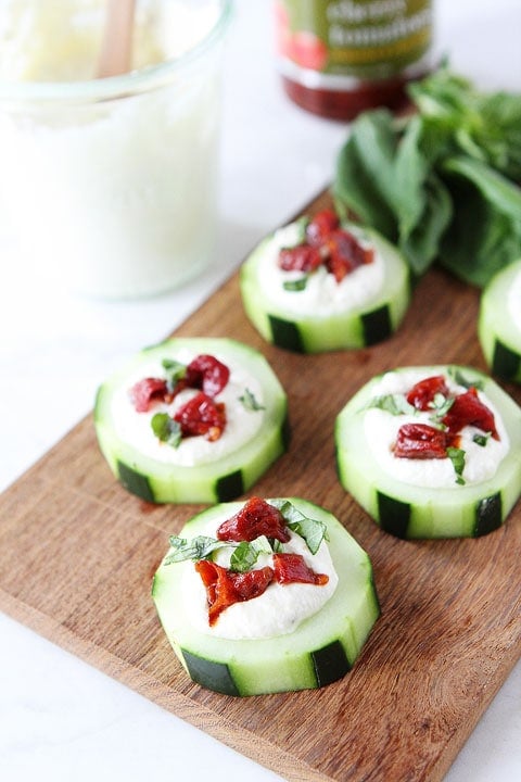 Cucumber Canapés with Whipped Feta, Sun-Dried Tomatoes and Basil on twopeasandtheirpod.com Cucumber Canapés with Whipped Feta, Sun-Dried Tomatoes and Basil on twopeasandtheirpod.com