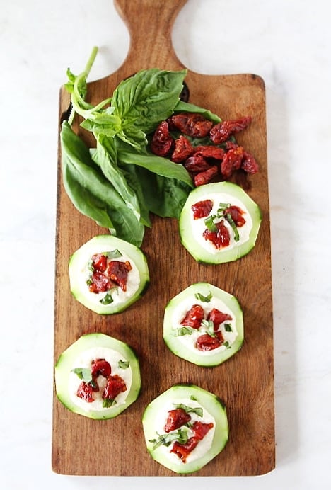 Cucumber Canapés with Whipped Feta, Sun-Dried Tomatoes and Basil on twopeasandtheirpod.com #recipe Cucumber Canapés with Whipped Feta, Sun-Dried Tomatoes and Basil on twopeasandtheirpod.com #recipe