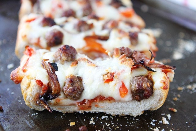 Easy French Bread Pizza on twopeasandtheirpod.com Easy French Bread Pizza Slices