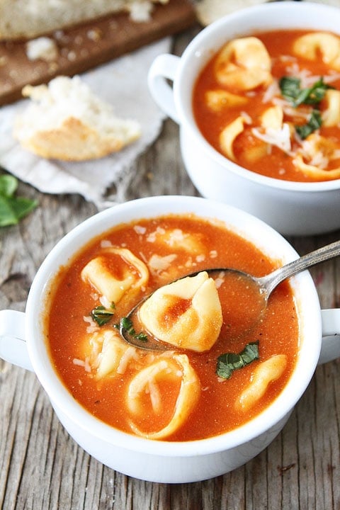 Creamy Tomato Tortellini Soup Recipe on twopeasandtheirpod.com Everyone LOVES this soup! It is easy to make and is great for lunch or dinner! spoon full of creamy tortellini soup