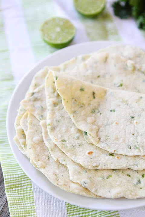 Homemade Flour Tortillas Recipe on twopeasandtheirpod.com Make tortillas once and you will be hooked for life! They are so easy and SO good! Soft Homemade Tortillas flavored with cilantro and lime