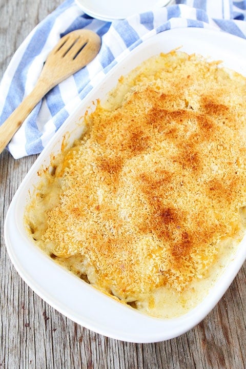 You will LOVE these Parmesan Crusted Scalloped Potatoes! The potatoes are SO cheesy and delicious. The perfect side dish! #potatoes #scallopedpotatoes #sidedish #Easter #holidayrecipe #dinner #dinnerrecipe Parmesan Crusted Scalloped Potatoes in pan