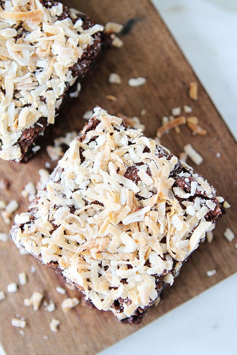 Coconut Brownie Recipe Coconut Brownie Recipe on twopeasandtheirpod.com. Fudgy brownies topped with coconut! Love these rich brownies!