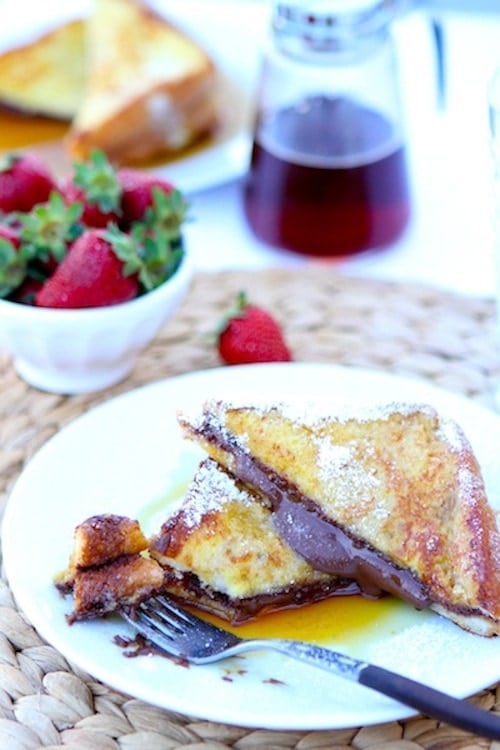 Nutella Stuffed French Toast Recipe Nutella Stuffed French Toast Recipe on twopeasandtheirpod.com. This decadent French toast recipe is perfect for special occasions!
