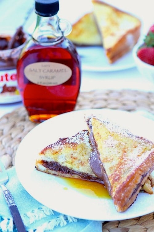 Nutella Stuffed French Toast Recipe Nutella Stuffed French Toast Recipe on twopeasandtheirpod.com. This decadent French toast recipe is divine! A must make for special occasions!
