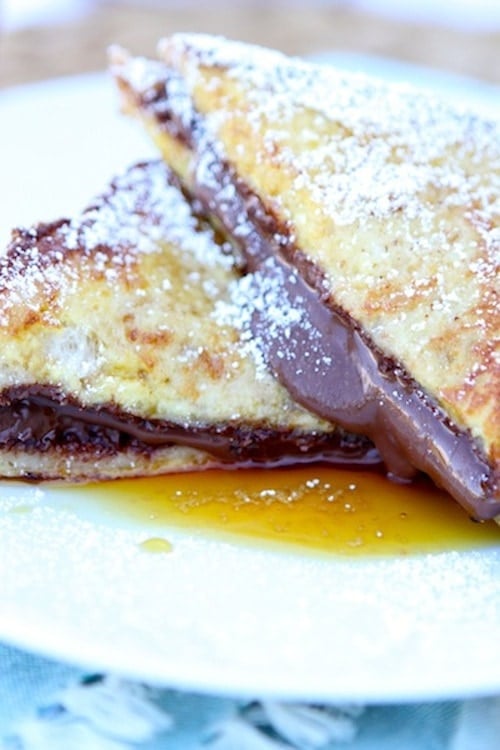 Nutella Stuffed French Toast Recipe Nutella Stuffed French Toast Recipe on twopeasandtheirpod.com. Nutella lovers will go crazy for this decadent French toast recipe!