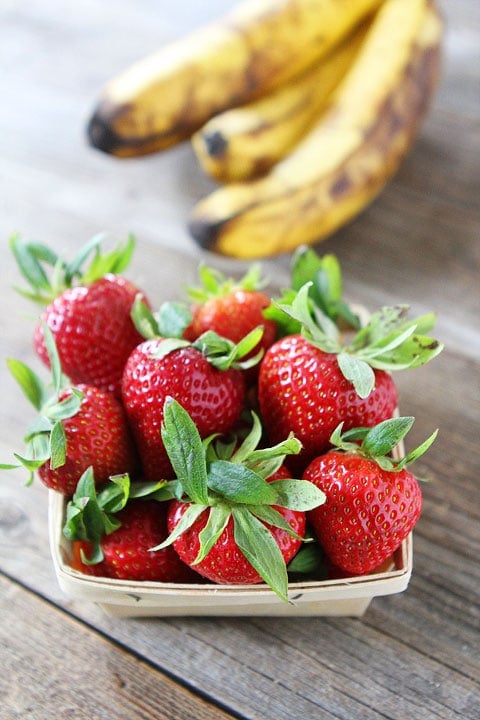 Whole Wheat Strawberry Banana Muffins Recipe on twopeasandtheirpod.com. fresh strawberries and ripe bananas for strawberry banana muffins