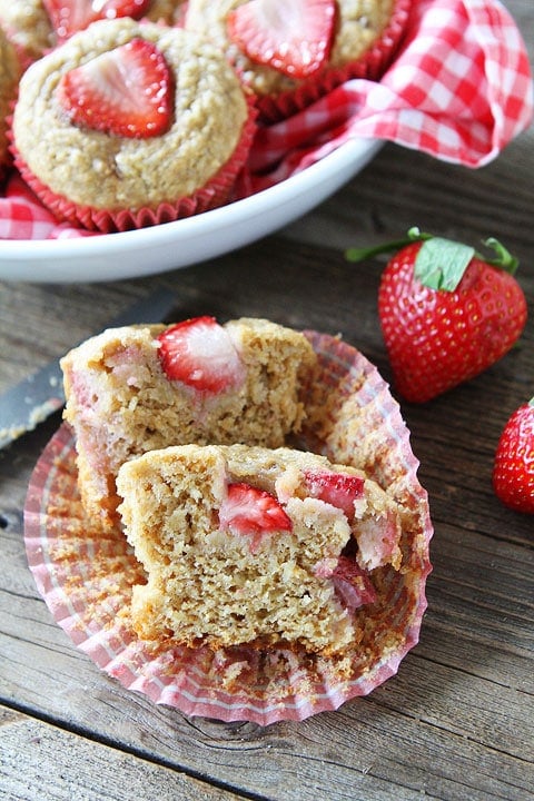 Whole Wheat Strawberry Banana Muffins Recipe on twopeasandtheirpod.com. A great recipe for using up your brown bananas! Banana Muffins with strawberries are a great way to use up bananas
