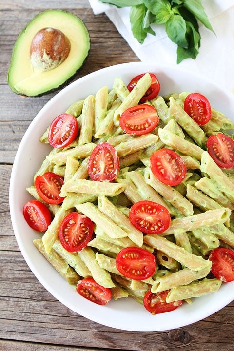 Avocado Goat Cheese Pasta Recipe on twopeasandtheirpod.com This simple and creamy pasta dish is full of flavor and can be made in under 30 minutes! It is a great weeknight dinner! Avocado Goat Cheese Pasta Recipe