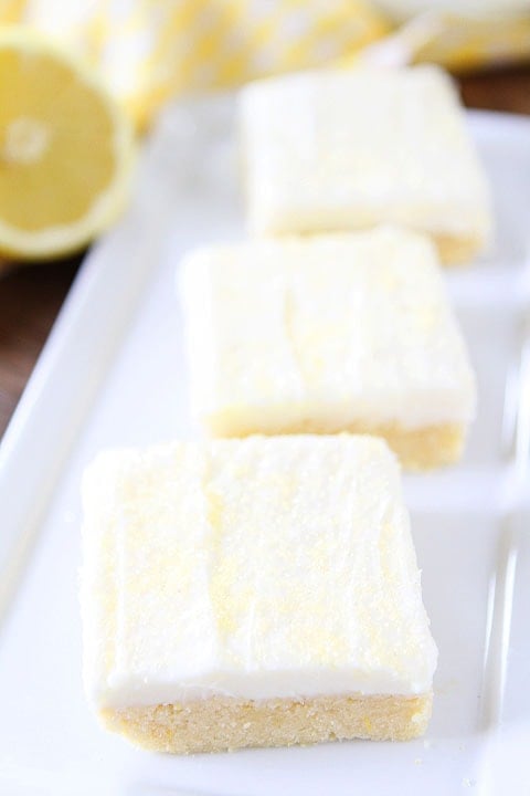 Lemon Sugar Cookie Bars with Lemon Cream Cheese Frosting Recipe Lemon Sugar Cookie Bars Recipe on twopeasandtheirpod.com. Soft sugar cookie bars with lemon cream cheese frosting! Everyone will want this recipe! #lemon #dessert