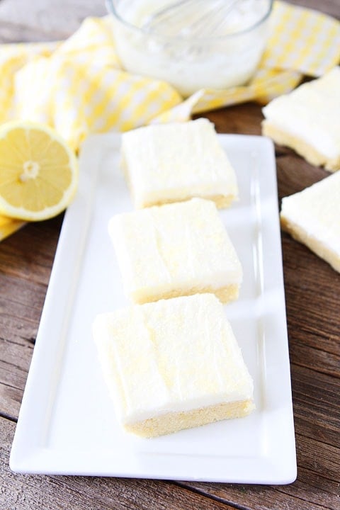 Lemon Sugar Cookie Bars Recipe Lemon Sugar Cookie Bars Recipe on twopeasandtheirpod.com. Perfect bars for entertaining! Love the lemon cream cheese frosting! #lemon #dessert