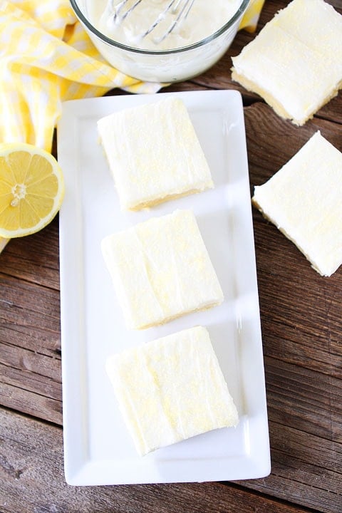 Lemon Sugar Cookie Bars Lemon Sugar Cookie Bars Recipe on twopeasandtheirpod.com. Sugar cookie bars with lemon cream cheese frosting! A favorite at our house! #lemon #bars #dessert