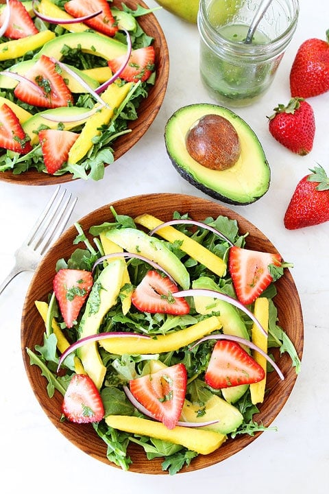 Mango, Strawberry, and Avocado Arugula Salad Recipe Mango, Strawberry, and Avocado Arugula Salad Recipe on twopeasandtheirpod.com. This gorgeous salad is simple to make and perfect for summer! #salad