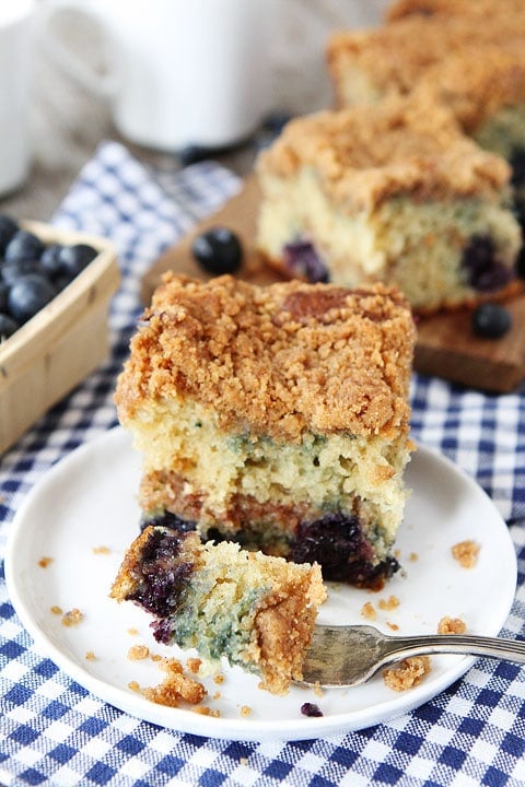 Blueberry Coffee Cake Recipe on twopeasandtheirpod.com. This coffee cake recipe is a family favorite! #cake #recipe Eating Blueberry Coffee Cake With Fork