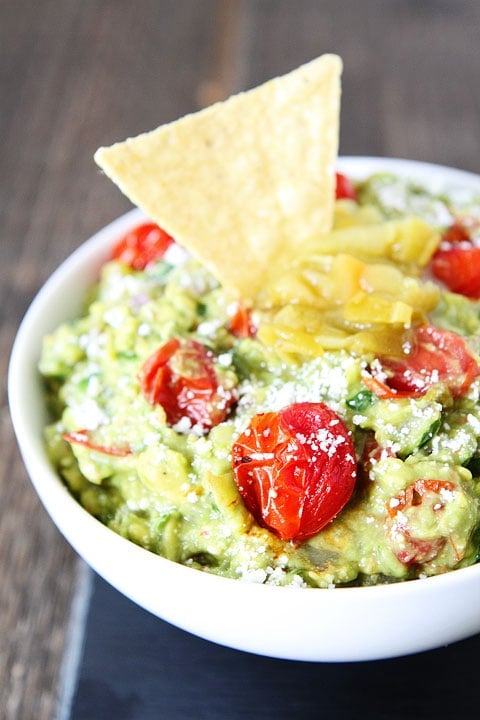 Green Chile and Roasted Tomato Guacamole Recipe Green Chile and Roasted Tomato Guacamole Recipe on twopeasandtheirpod.com This guacamole recipe is a favorite at our house! #appetizer #glutenfree