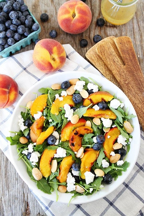 Grilled Peach, Blueberry, and Goat Cheese Arugula Salad Recipe Grilled Peach, Blueberry, and Goat Cheese Arugula Salad Recipe on twopeasandtheirpod.com #salad #summer #vegetarian