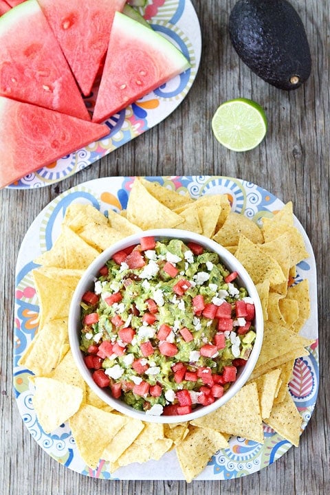 Watermelon Feta Guacamole Recipe Watermelon Feta Guacamole Recipe on twopeasandtheirpod.com. The perfect guacamoel for summer! #glutenfree #summer