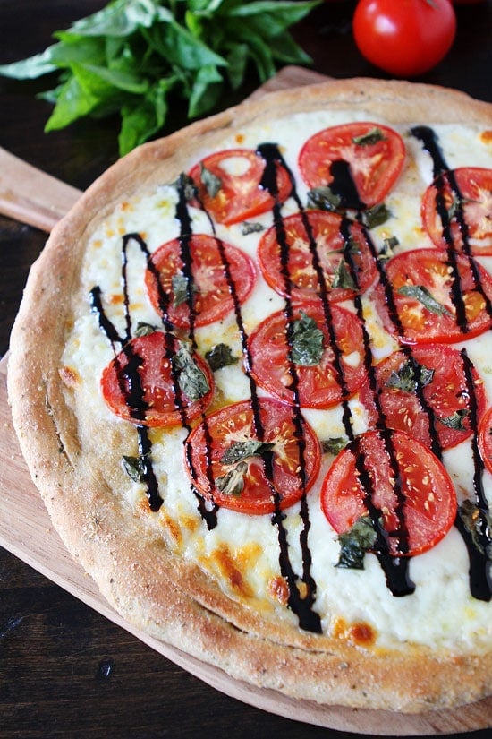 Easy Whole Wheat Pizza Dough Recipe Easy Whole Wheat Pizza Dough Recipe on twopeasandtheirpod.com The BEST whole wheat pizza dough recipe and it freezes well too! #pizza