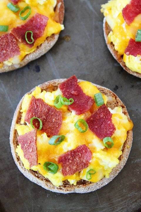 English Muffin Breakfast Pizza Recipe English Muffin Breakfast Pizzas on twopeasandtheirpod.com #recipe #breakfast #backtoschool