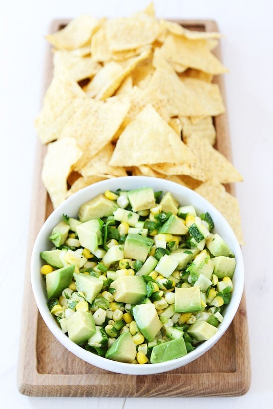 Zucchini, Corn, and Avocado Salsa Recipe Zucchini, Corn, and Avocado Salsa Recipe on twopeasandtheirpod.com You will fall in love with this fresh and simple summer salsa! It is SO good!