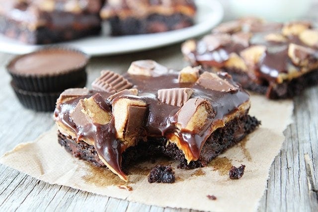 Chocolate Peanut Butter Brownie Recipe on twopeasandtheirpod.com The BEST brownies you will ever eat! The chocolate and peanut butter combo is to die for! Chocolate Peanut Butter Brownies with melted peanut butter cups on top