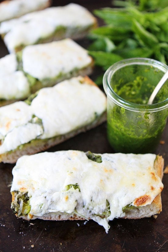 Pesto Cheese Bread Recipe Pesto Cheese Bread Recipe on twopeasandtheirpod.com You only need 4 ingredients to make this cheesy bread! #recipe