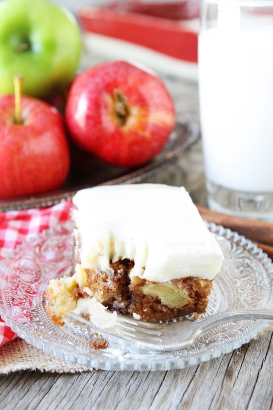 Apple Cake with Cream Cheese Frosting Recipe on twopeasandtheirpod.com This apple cake is a family favorite! #apple #cake Apple cake served with glass of milk