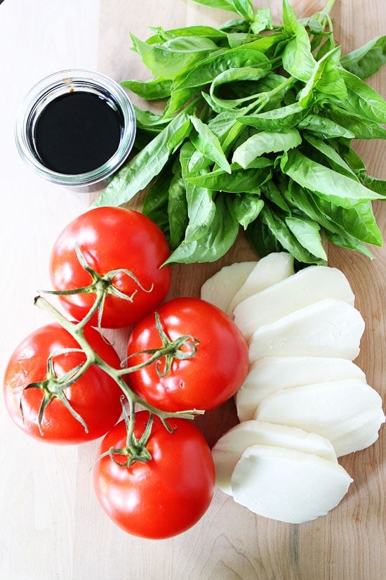 Caprese Pizza Recipe on twopeasandtheirpod.com Caprese Pizza Recipe on twopeasandtheirpod.com