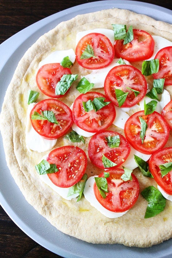Caprese Pizza Recipe Caprese Pizza Recipe on twopeasandtheirpod.com We love this easy pizza!